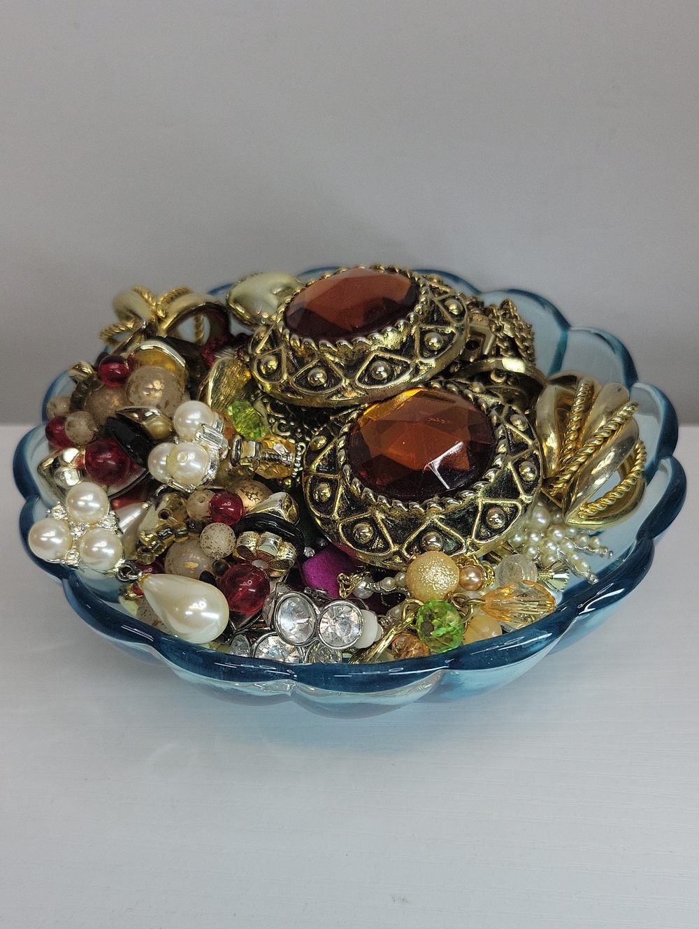 Vintage Clip On Earrings In A Glass Dish